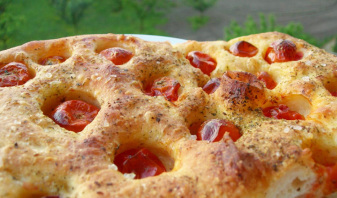 Pillowy focaccia with cherry tomatoes